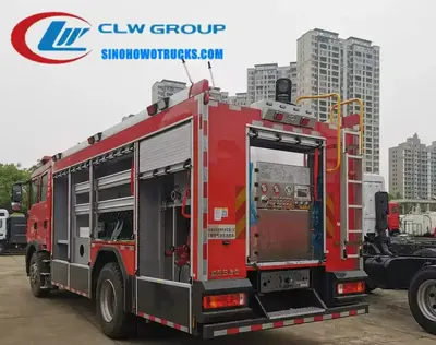 Rear view of the HOWO fire truck showing the pump room, gauges, and control panel