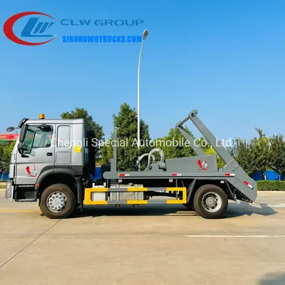 Side view of the skip loader truck showing the high strength steel swing arm lifting a sealed rectangular bin