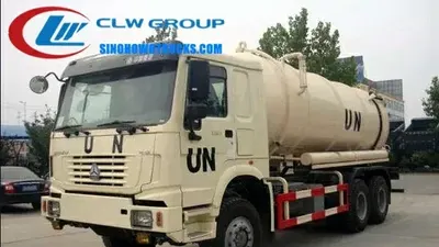 Side view of the 6WD HOWO sewage tanker showing the middle tipper mechanism and front control panel