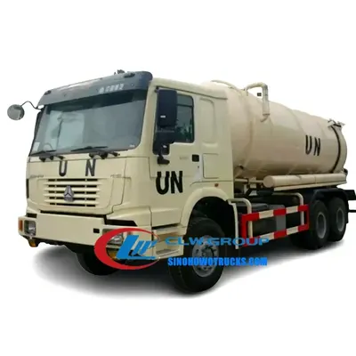 6WD Sinotruk HOWO off-road sludge pump truck in Ethiopia with rear hydraulic door open and suction hose extended