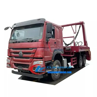 Rear view of the skip truck with the hydraulic lift system engaged and skip body in position