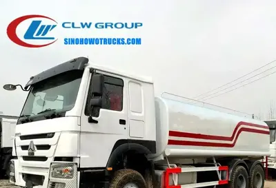 Side view of the 6X4 HOWO water bowser truck showing spray nozzles and high cannon