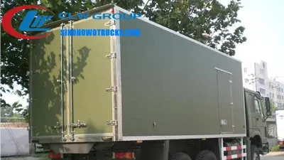Side view of the 6x6 HOWO reefer truck showing 12.00R20 tires and long cabin with air conditioning