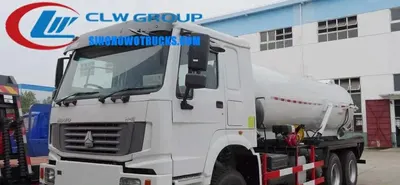 Side view of the 6X6 HOWO sewage truck showing hose racks on both sides and 100 mm suction pipe