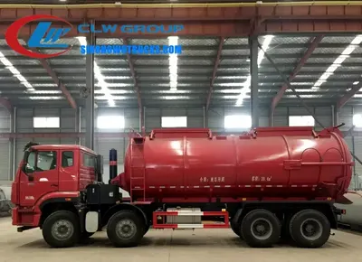 Side view of the HOWO sewage vacuum truck showing cab, side operation panel, and tailgate mechanism