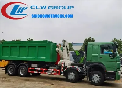 Rear view of the hook lift system on the HOWO truck with hydraulic cylinders and lifting arms