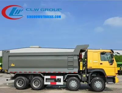 8x4 Sinotruk HOWO 40 ton gravel truck with front-lift tipper body in red and yellow livery