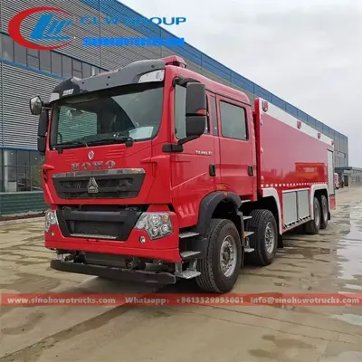 Side view of the fire tender with open aluminium alloy roller shutter lockers and hose storage