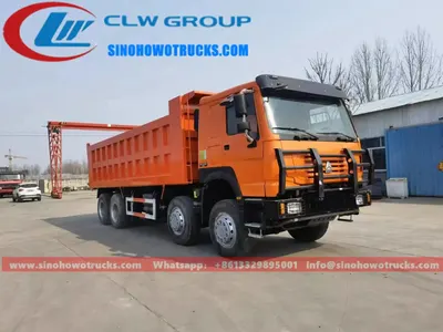 Side view of the 8x8 HOWO dump truck showing high strength steel tipper body and 12.00R20 tires