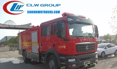 CNHTC 10 tons water and foam fire truck in fire service red with top-mounted monitor and rear folding ladder