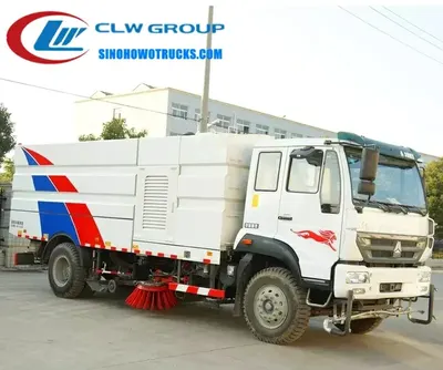 Side view of the CNHTC Steyr road sweeper showing stainless steel dustbin and hydraulic tipping system