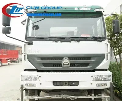 Rear view of the CNHTC Steyr vacuum road sweeper with high-pressure sprayers and water tank access