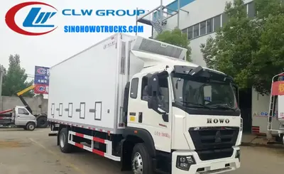 Side view of the HOWO chick carrier truck showing FRP panels and exhaust vents