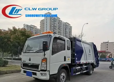 HOWO 10m3 refuse truck in white and green with custom logo on front doors and sides