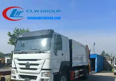 Rear loading mechanism of the HOWO compactor truck with hydraulic lift and container clamp