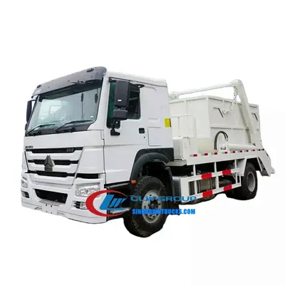 Rear view of the HOWO skip loader truck showing hydraulic lift system and container locking pins