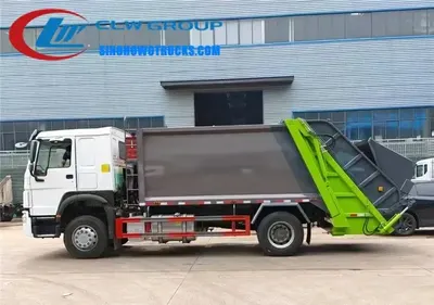 Sinotruk HOWO 14cbm compact bin truck in urban waste collection service with rear loading gate open