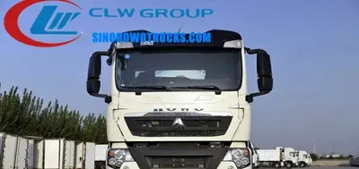 Side view of the HOWO vacuum truck showing the round 4000L tank and control panel