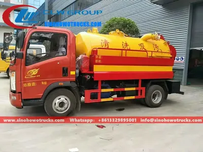 Side view of the HOWO 5000L sewer jetting truck showing suction pipe and control panel