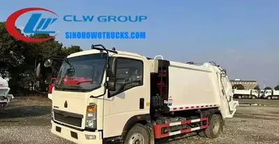 Side view of the HOWO waste compactor truck with high strength steel body and 8.25R16 tires