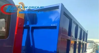 Rear view of the HOWO hooklift truck showing the hydraulic hook and locking mechanism