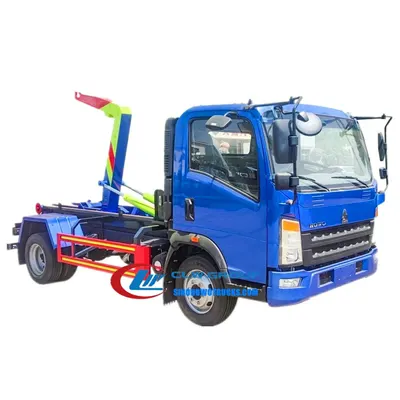 HOWO 5cbm hooklift truck in urban waste collection setting with rear-mounted container being lifted