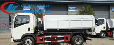 HOWO 5m3 mini hook loader garbage truck with detachable hopper in urban waste collection setting