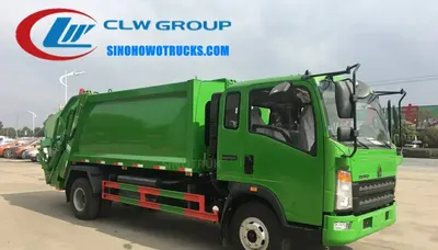 Side view of the HOWO compactor truck showing high-strength T420 steel body and hydraulic compaction system