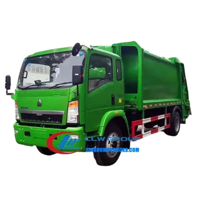 Rear loading gate and compaction ram in action on the HOWO waste truck