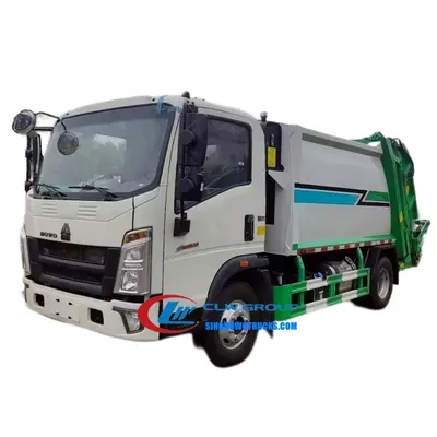 HOWO 6cbm refuse compactor truck in urban waste collection service with rear loading hopper open