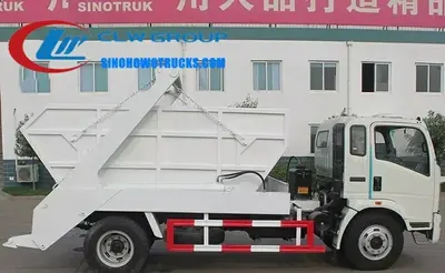 Side view of Howo 6ton skip loader truck showing the 4x2 chassis and rectangular skip container