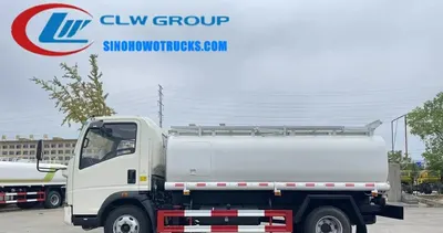 Side view of the HOWO fuel tanker showing aluminum manhole cover and breather valve