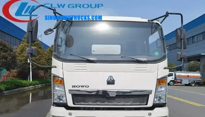 Side view of the HOWO sewer truck with 5 metre suction pipe and inspection window