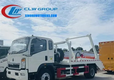 Rear view of Howo 8m3 skip loader with open skip container and sewage collection box visible