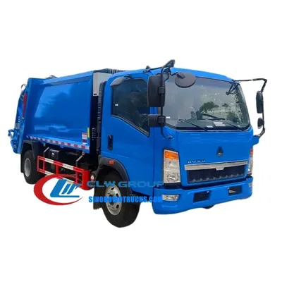 Rear loading area of the HOWO garbage truck with hydraulic system and bucket lifting option