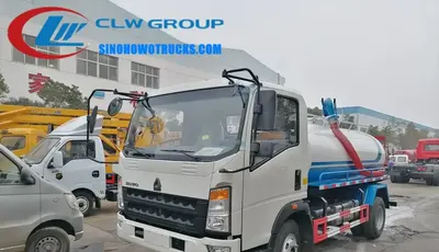 Side view of the HOWO toilet truck with tank lift dump mechanism and hydraulic door