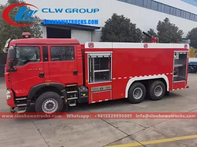 Side view of the HOWO T5G fire truck showing roller shutter lockers and hose storage compartments