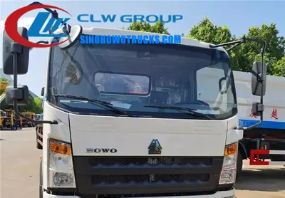 Side view of RHD HOWO compactor truck showing high-strength T420 steel body and 120L bin loading