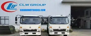 Right hand drive Sinotruk rubbish lorry in urban waste collection setting with compaction body open