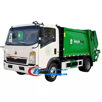 Rear view of the right hand drive rubbish lorry with rear flip and dumping mechanism in operation