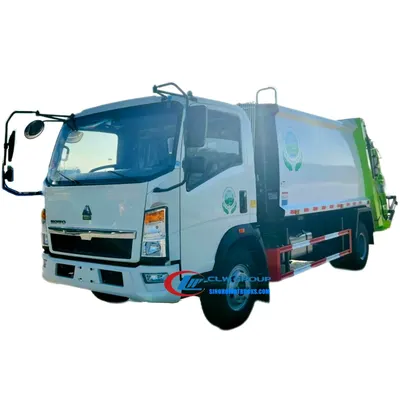Rear view of the garbage truck with compaction mechanism and sewage tank access door