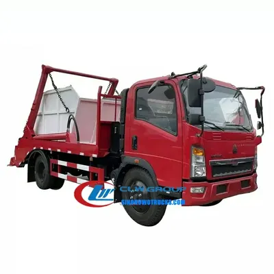Sinotruk 3.5 t skip truck in urban waste collection setting with swing arm lifting a 5m3 skip body
