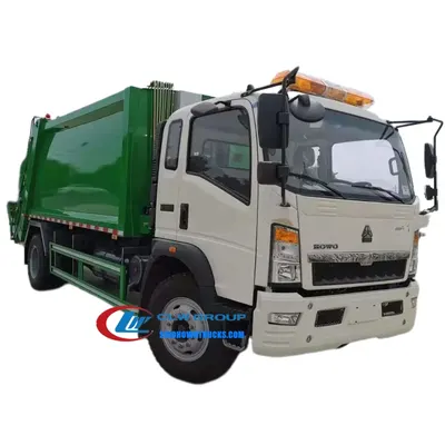 Rear view of the HOWO waste truck with compaction cylinder and discharge door