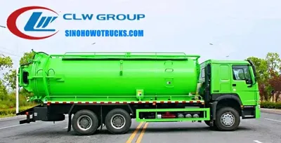 Side view of the HOWO vacuum truck showing the cylindrical tank, suction pipe, and access doors