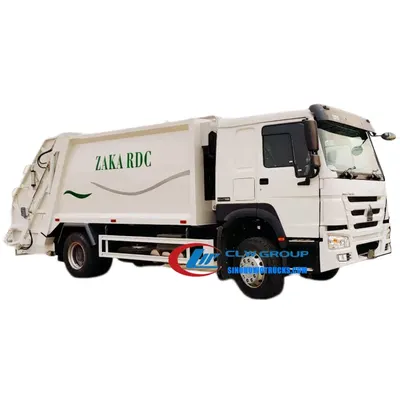 Side view of the back loader garbage truck with open rear door and waste loading chute