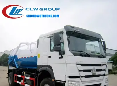 Side view of the HOWO sewage tanker showing the 10,000 L carbon steel tank and hydraulic unloading system