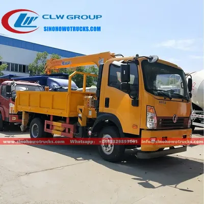 Sinotruk 4 ton truck loader crane in Cambodia with telescopic boom extended and crane in operation