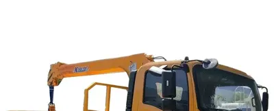 Side view of the 4 ton truck crane showing the high-strength cargo box and crane mounting frame