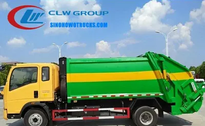 Side view of the rear loader truck showing hydraulic bin lifter and sealed compaction chamber