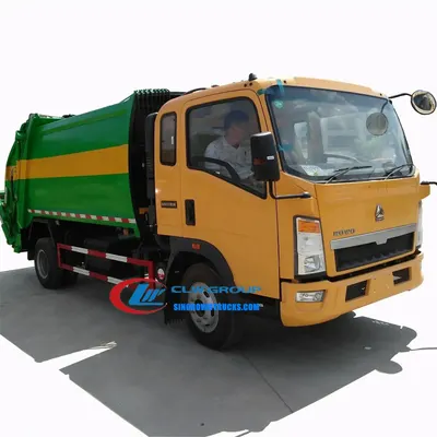 Sinotruk HOWO 4x2 rear loader recycling truck with 5 m³ compaction body in urban waste collection setting